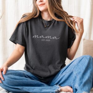 Pepper Comfort Colors Embroidered Mama T-Shirt with white embroidery 'mama EST. 2025', flat lay.