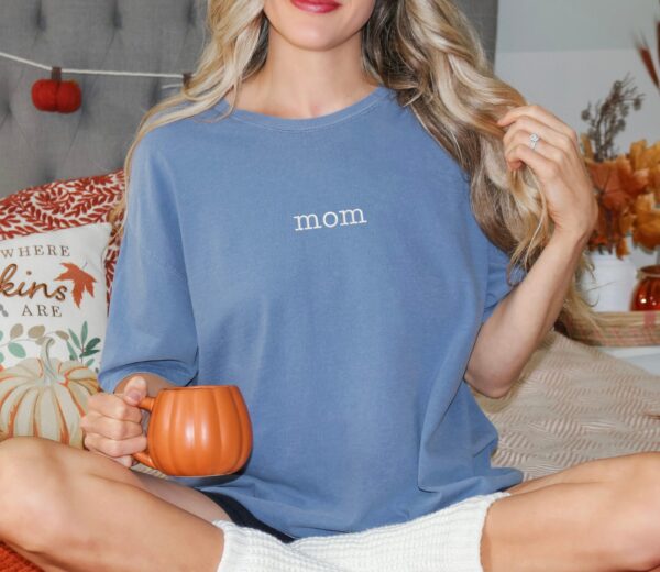 Blue Jean Comfort Colors Mom Shirt with simple white “mom” embroidery, laid-back mom style tee.
